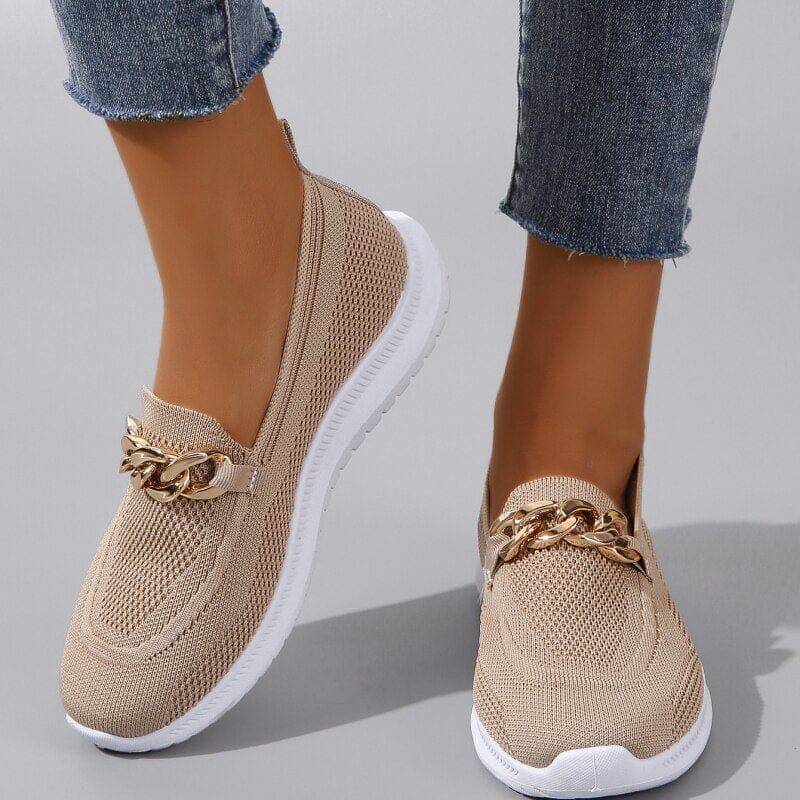 Beige knit slip-on sneakers with gold chain detail and white sole, available in white and black