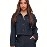 Dark blue cropped denim jacket with contrast stitching flap pockets and button closure designed for women by Sophia and Grace London