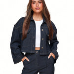 Dark blue cropped denim jacket with contrast stitching flap pockets and button closure designed for women by Sophia and Grace London