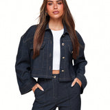 Dark blue cropped denim jacket with contrast stitching flap pockets and button closure designed for women by Sophia and Grace London