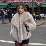 Oversized faux fur coat in soft grey with wide lapels and plush texture designed for women by Sophia and Grace London