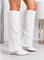 White knee-high boots with pointed toe and wedge heel in faux leather